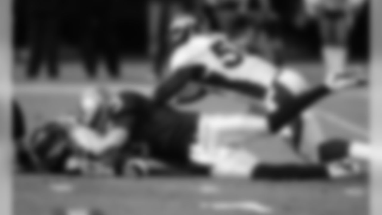 Miller strip-sacks Oakland QB Carson Palmer and DT Mitch Unrein recovers.