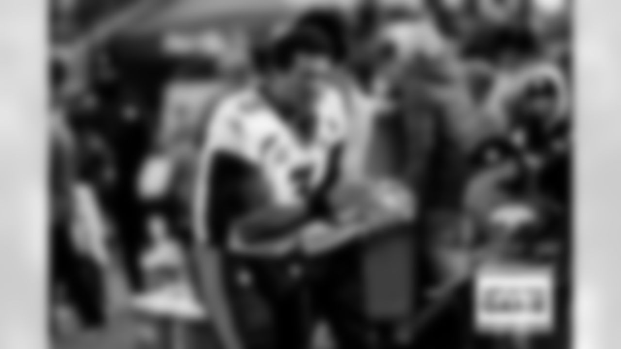 Russell Wilson encourages teammates on the sideline during the Broncos' Week 10 game against the Tennessee Titans at Nissan Stadium in Nashville, Tennessee on November 13, 2022. (Photo by Ben Swanson)