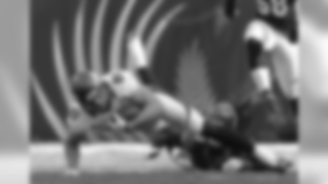 Dreessen keeps his elbows and knees off the ground trying to gain the extra yard.