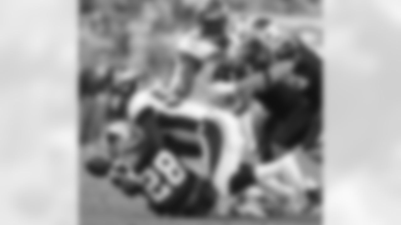 Miller forces a fumble as he tackles Panthers RB Jonathon Stewart.