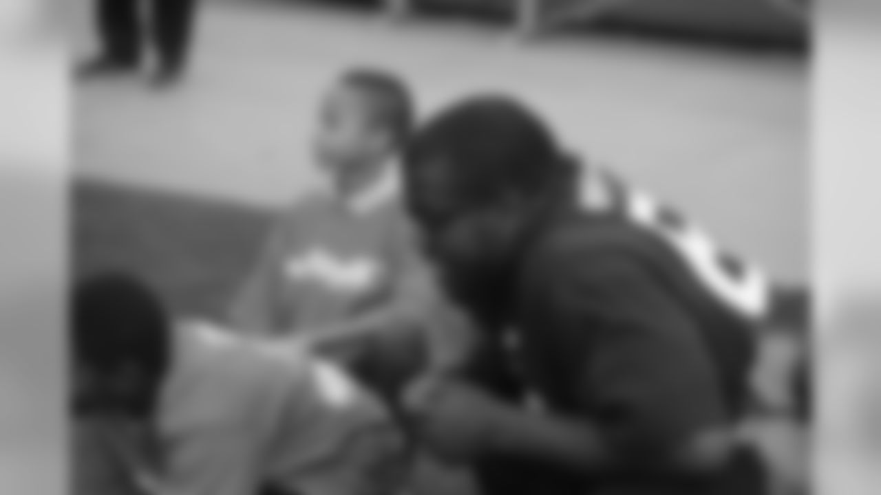 Saulsberry joins local kids at Tuesday night's Hometown Huddle.