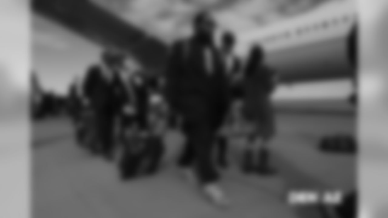 Domata Peko Sr. walks on the tarmac to the plane before the flight during the team's travel for their Week 7 game against the Arizona Cardinals on October 17, 2018.
