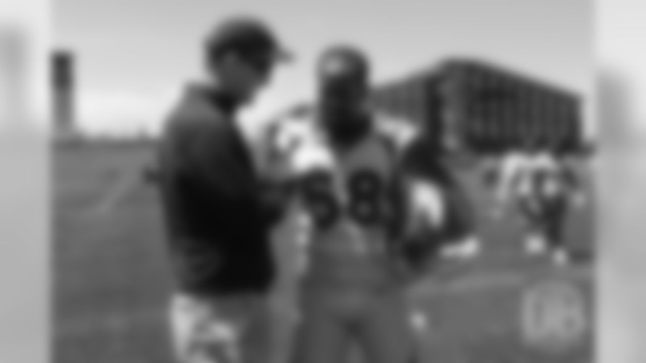 Von Miller and former Broncos quarterback Peyton Manning after the Broncos' practice on the eight day of their OTAs on May 30, 2019.