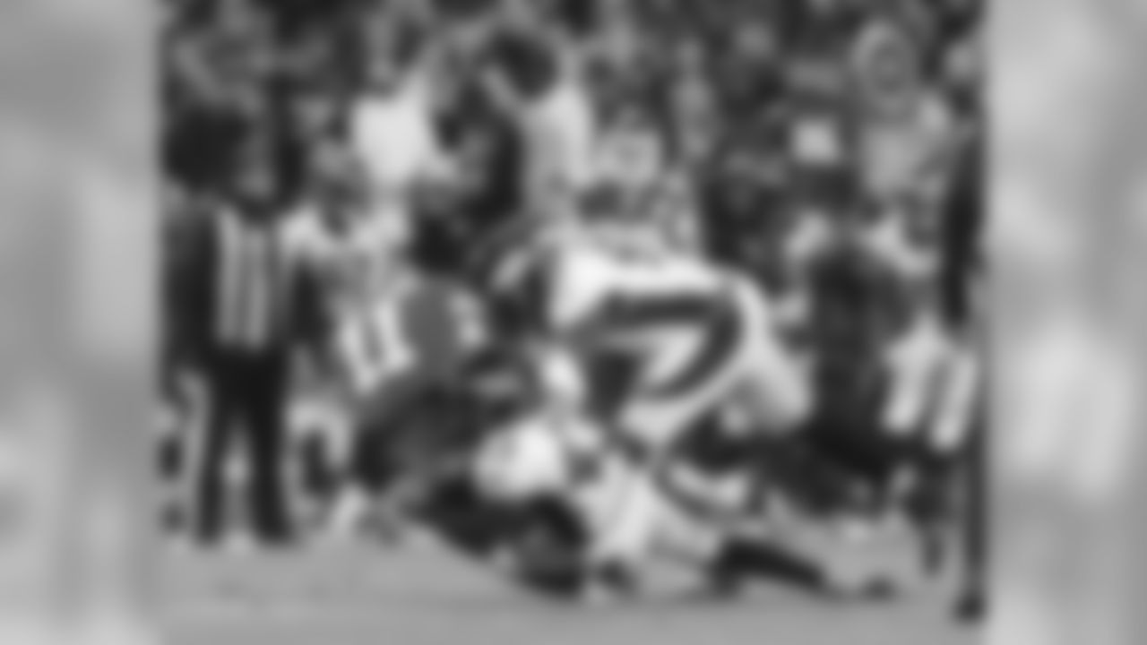 T.J. Ward and DeMarcus Ware