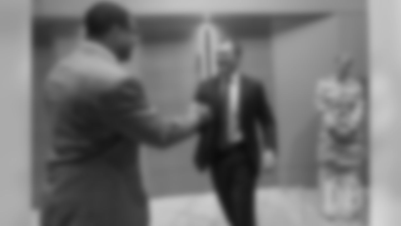 Steve Atwater greets John Lynch at the Pro Football Hall of Fame's Merlin Olsen Luncheon in Atlanta on February 1, 2019.