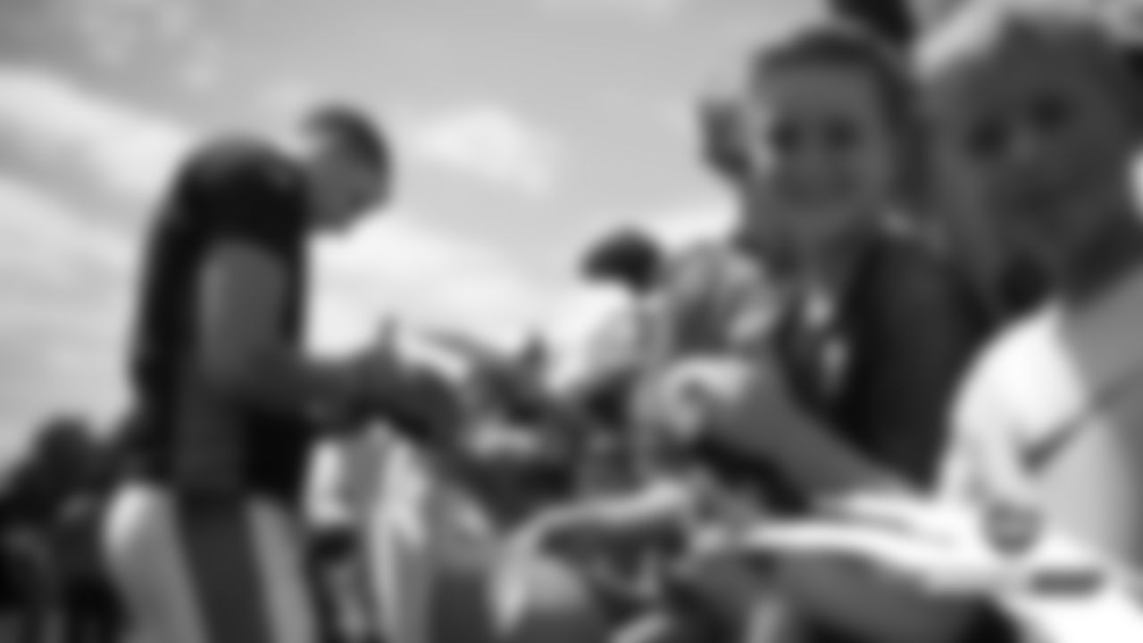 Brett Rypien signs autographs after practice on Day 7 of training camp on July 25, 2019.