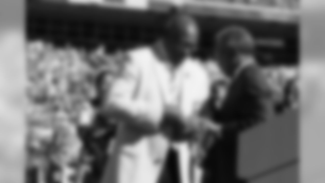 Denver Broncos Hall of Fame running back Floyd Little's adjusts his Hall of Fame ring before addressing the fans during Floyd Little's Hall of Fame ceremony at Invesco Field in Denver,CO.
