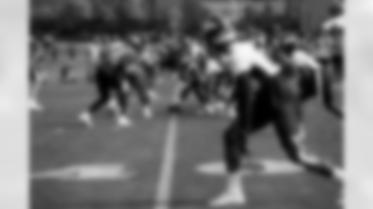 Lloyd Cushenberry III and Malik Reed and the offense and defense square during practice on the second day of training camp at UCHealth Training Center on July 29, 2021. (Photo by Sam Weaver)