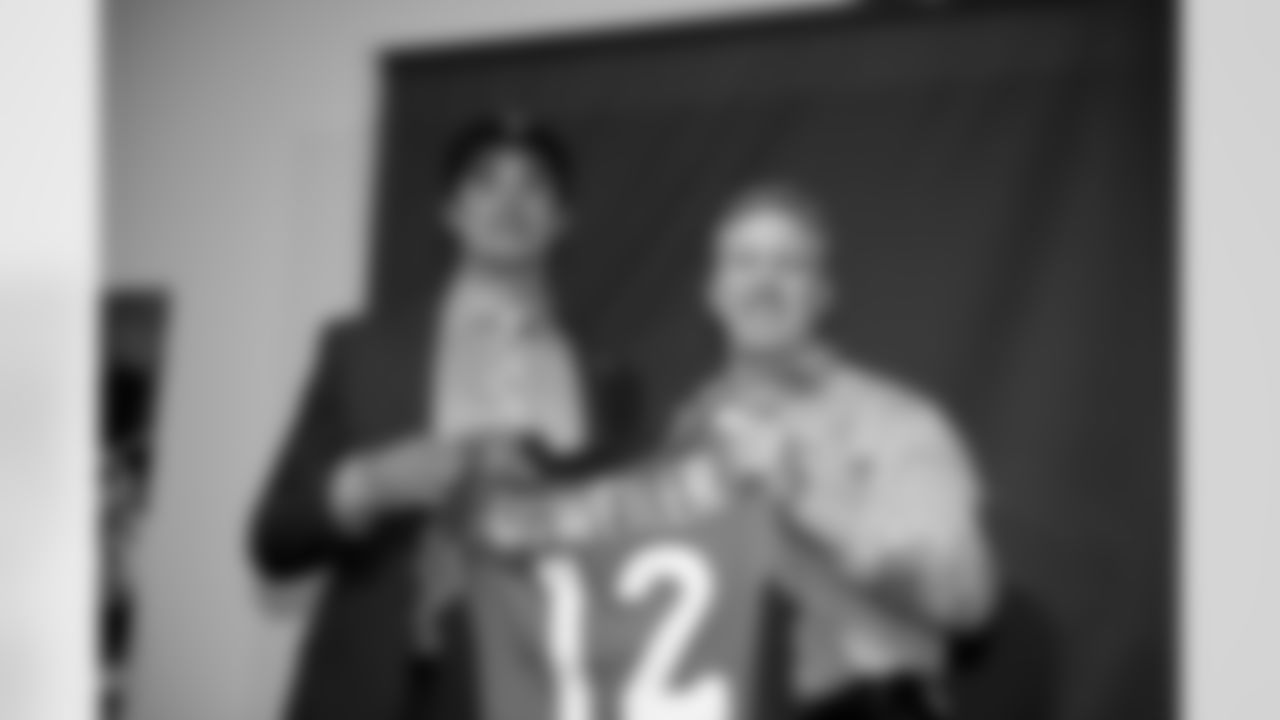 Denver Broncos draft pick Brock Osweiller,left, shows off his draft jersey with Executive Vice President of Football Operations John Elway during a press conference at the Dove Valley facility April 28, 2012 in Englewood,CO.