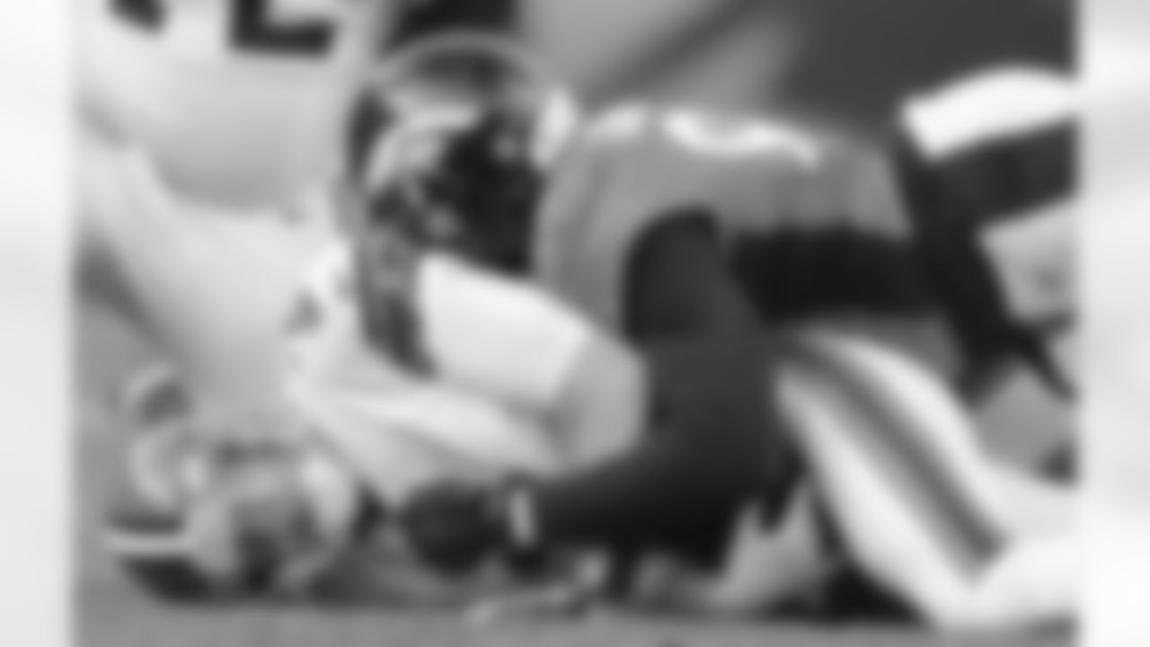 Dumervil splits a sack of Browns QB Brandon Weeden with LB Von Miller.