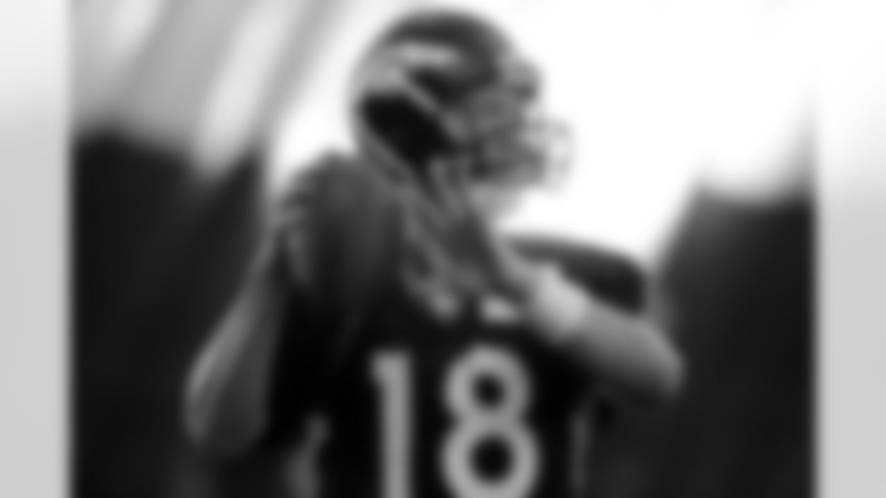 QB Peyton Manning throws a pass during practice.