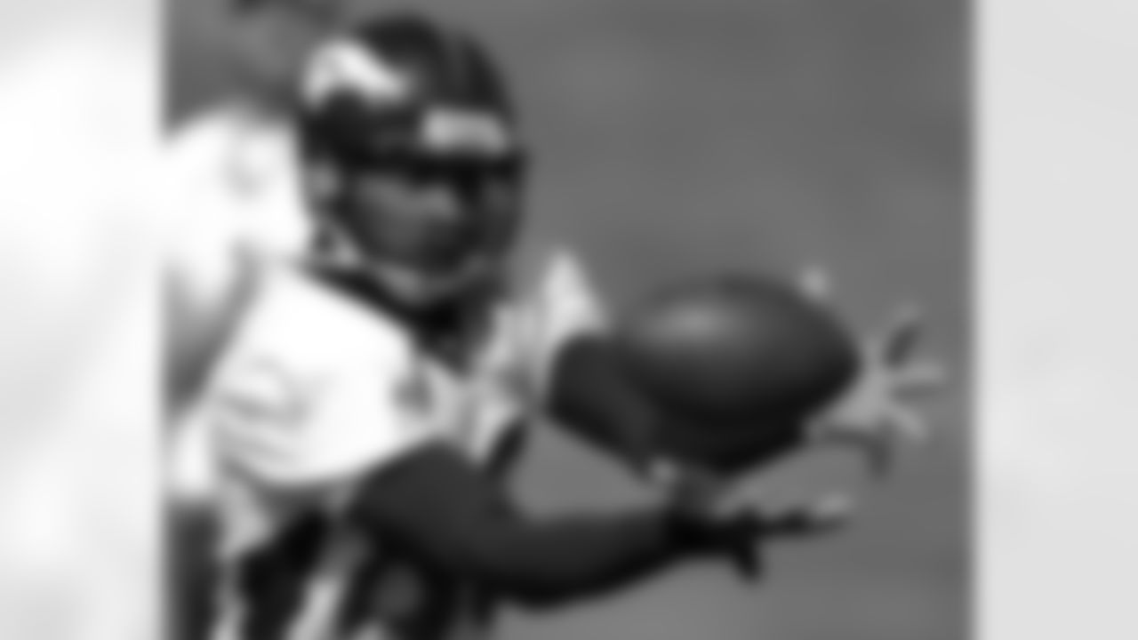 Smith pulls in a pass during the final day of training camp at Broncos headquarters in Denver, Friday, Aug. 20, 2004.