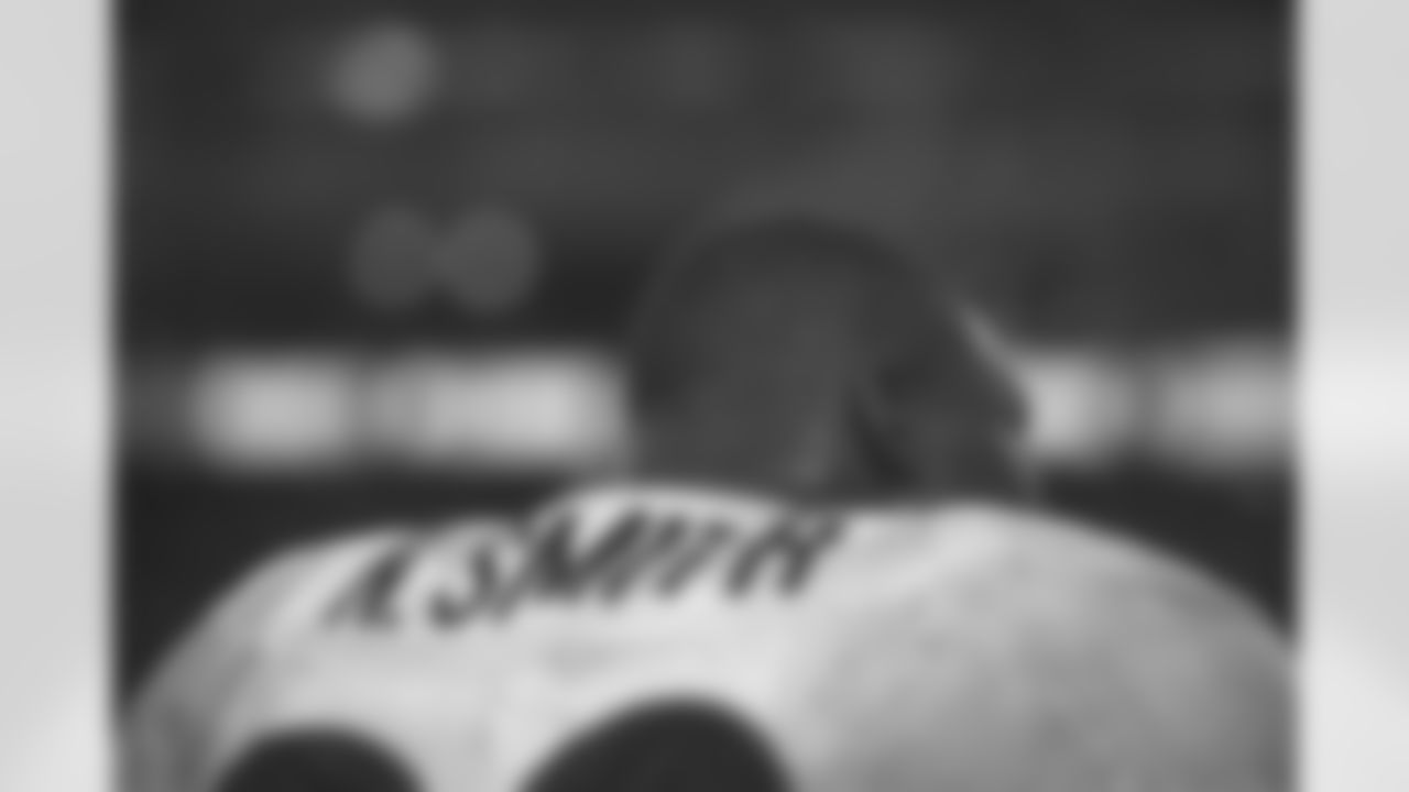 Kansas City: Neil Smith watches from the sideline as he steams against the Kansas City Chiefs at Arrowhead Stadium in Kansas City, MO on January 4, 1998.