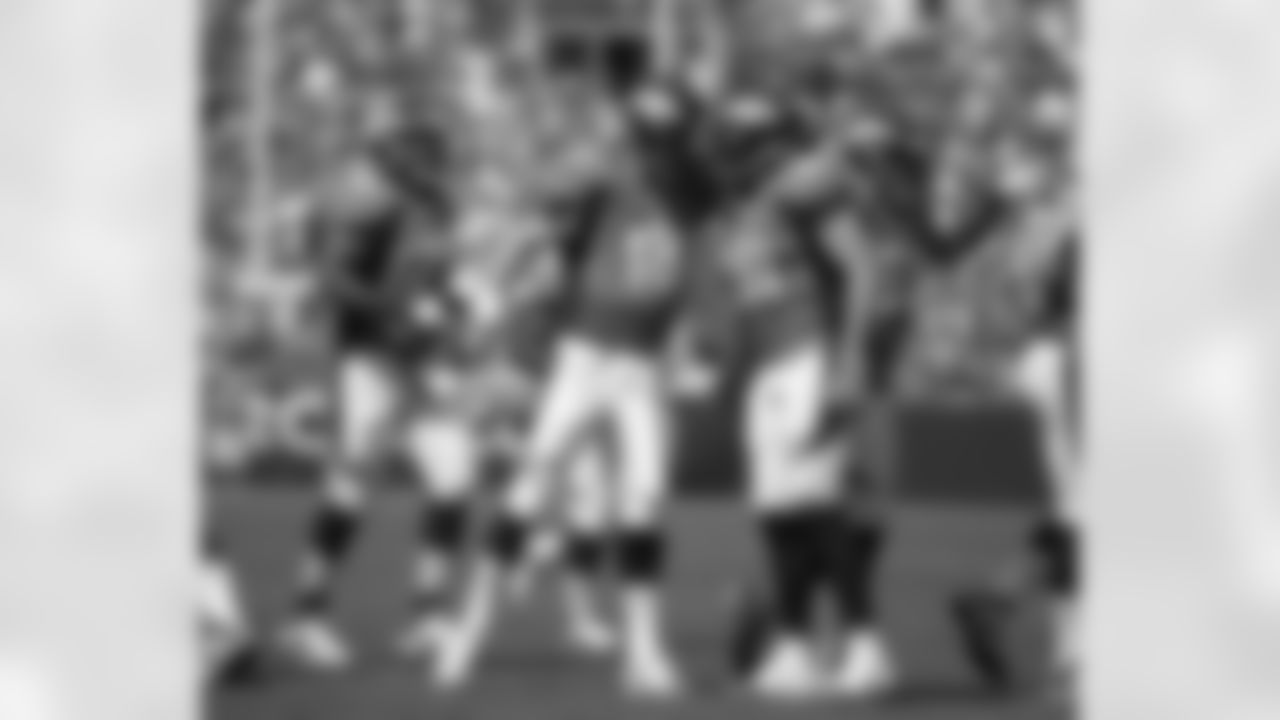 Quarterback Peyton Manning and tight end Joel Dreessen celebrate a big play.