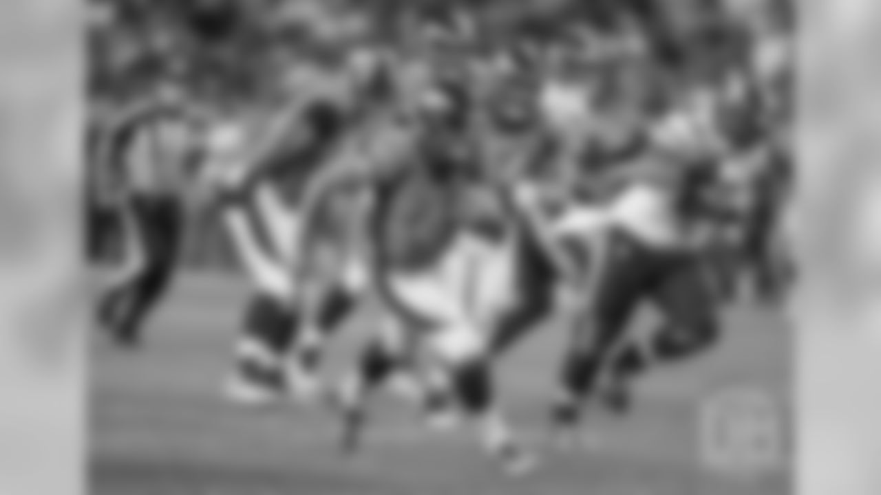 Quarterback Chad Kelly (6) scrambles against the Vikings.