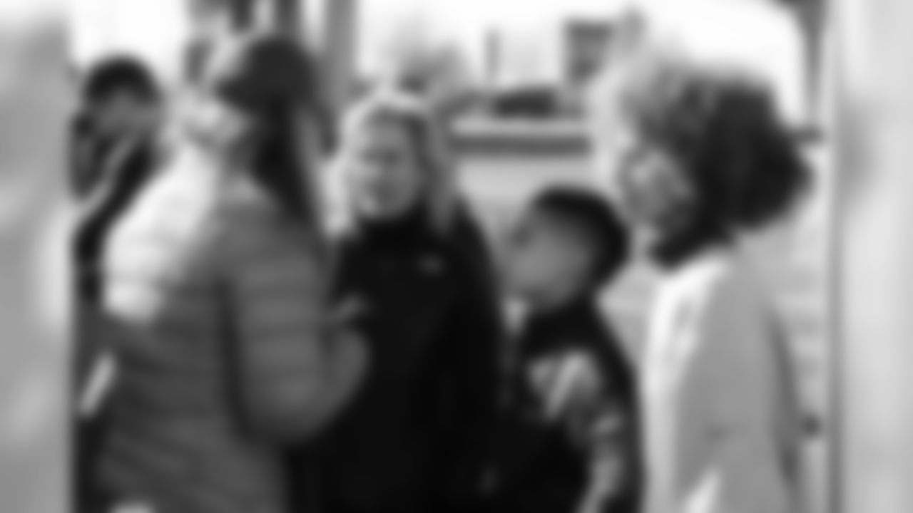 Holly, Stone and Nataly Joseph distribute food during the Denver Rescue Mission's Thanksgiving Turkey in a Box distribution on Nov. 20, 2018