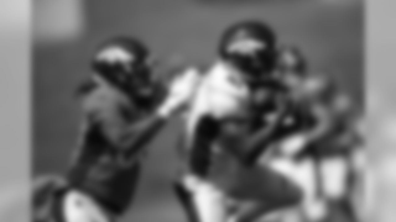 De'Vante Bausby makes an interception during the fourth training camp practice at UCHealth Training Center on August 16, 2020. (Photo by Ben Swanson)