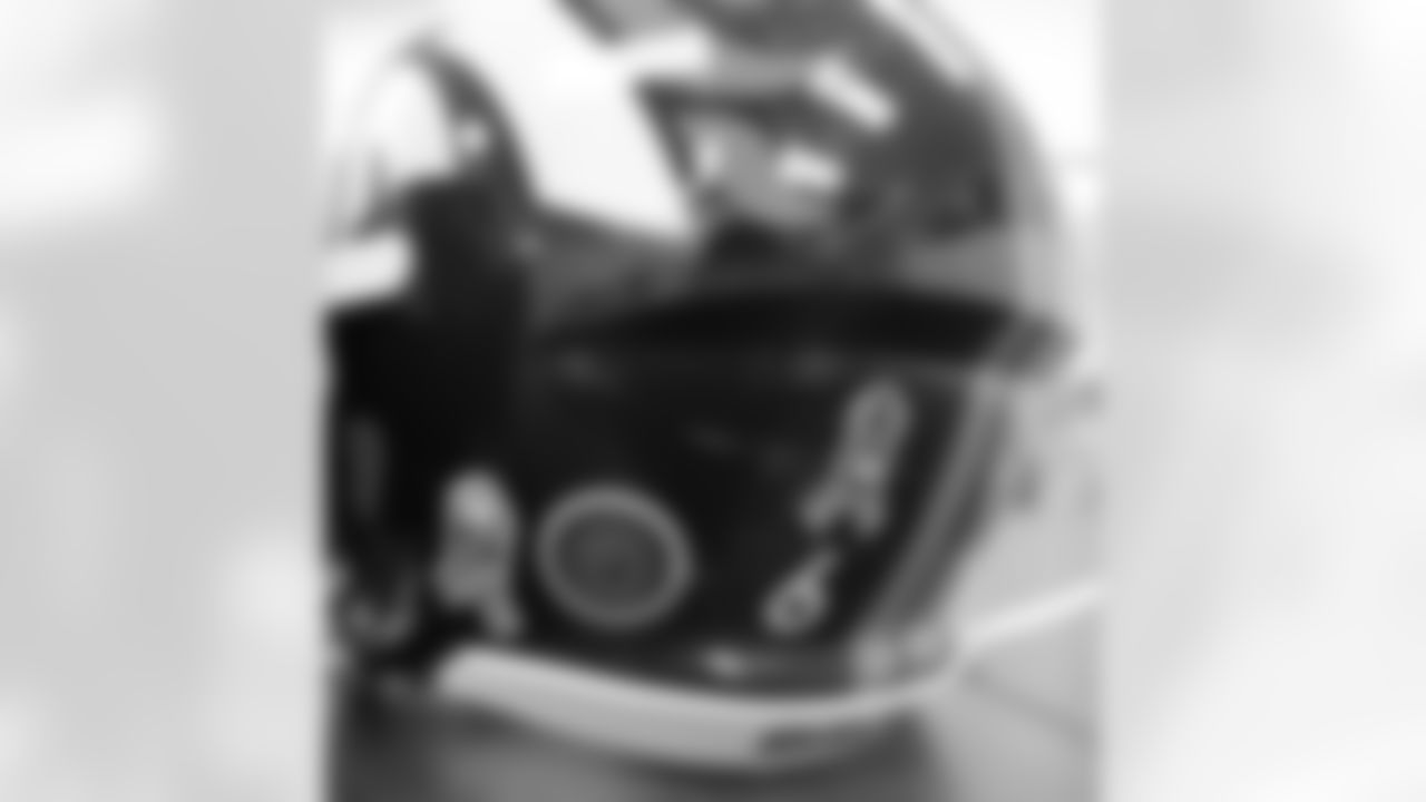 A look at the helmet of quarterback Brock Osweiler, which features a decal in honor of the Marine Corps.
