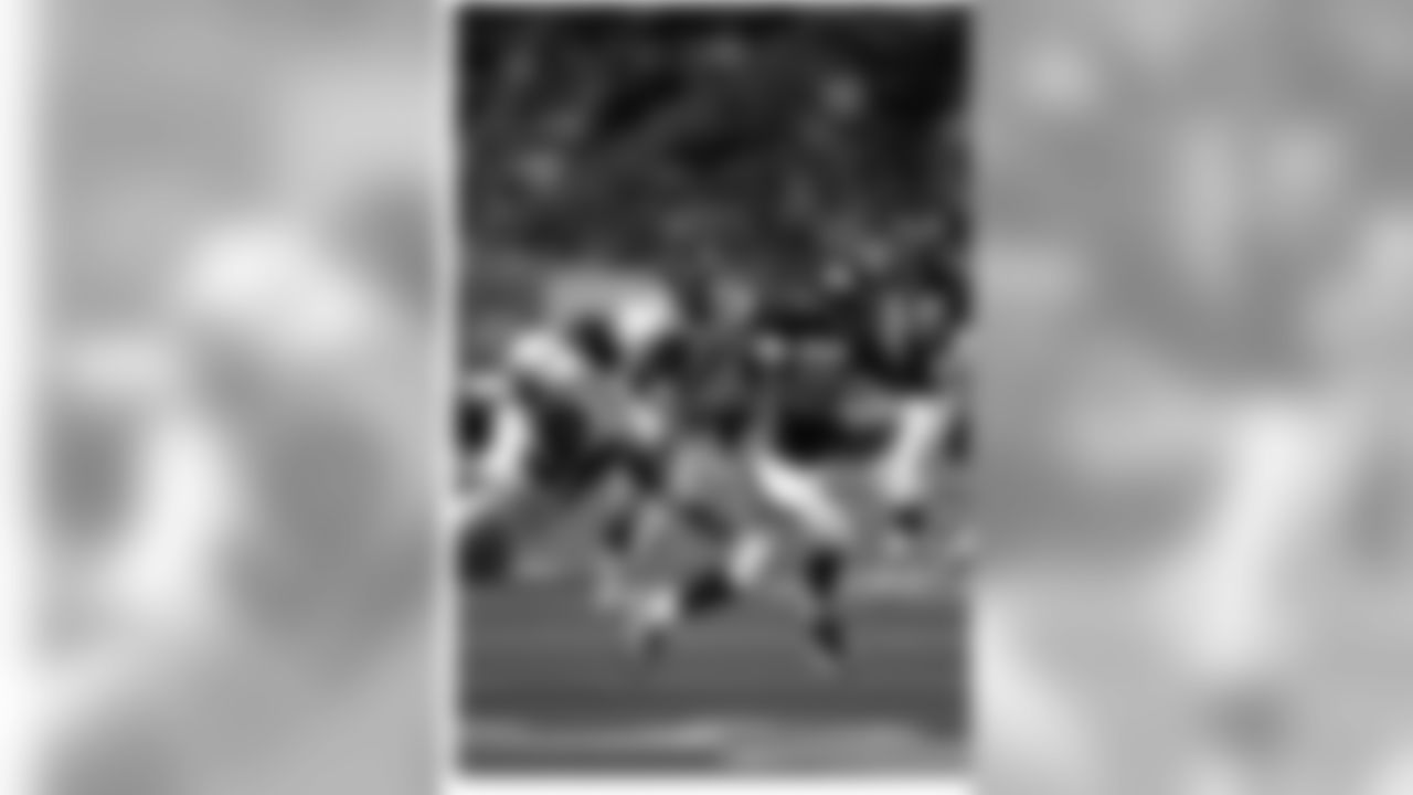 WR Rod Smith caught three passes for 28 yards, including this reception where he got past linebacker Henri Crockett.