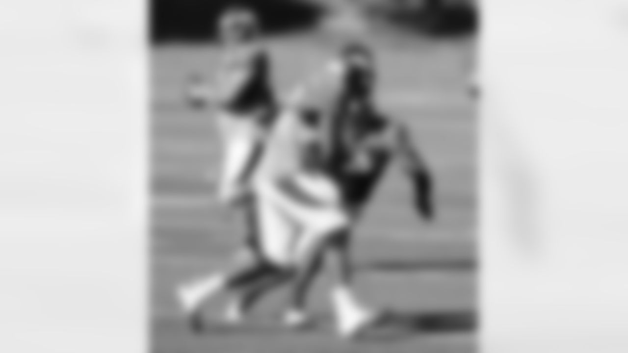 DE Elvis Dumervil lines up a hit during a tackling drill.