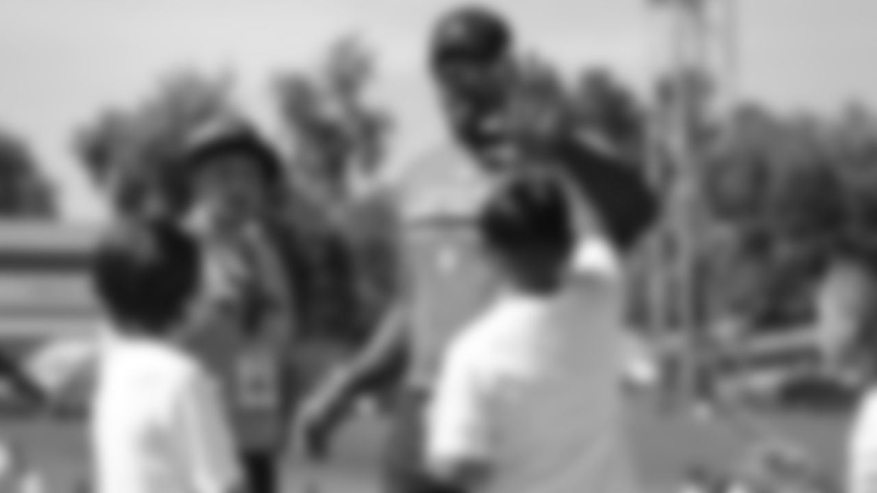Von Miller interacts with children at his youth football camp at Englewood High School on June 20, 2019.