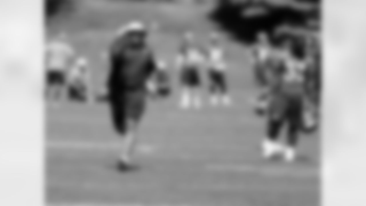 Running Backs Coach Eric Studesville demonstrates a drill.