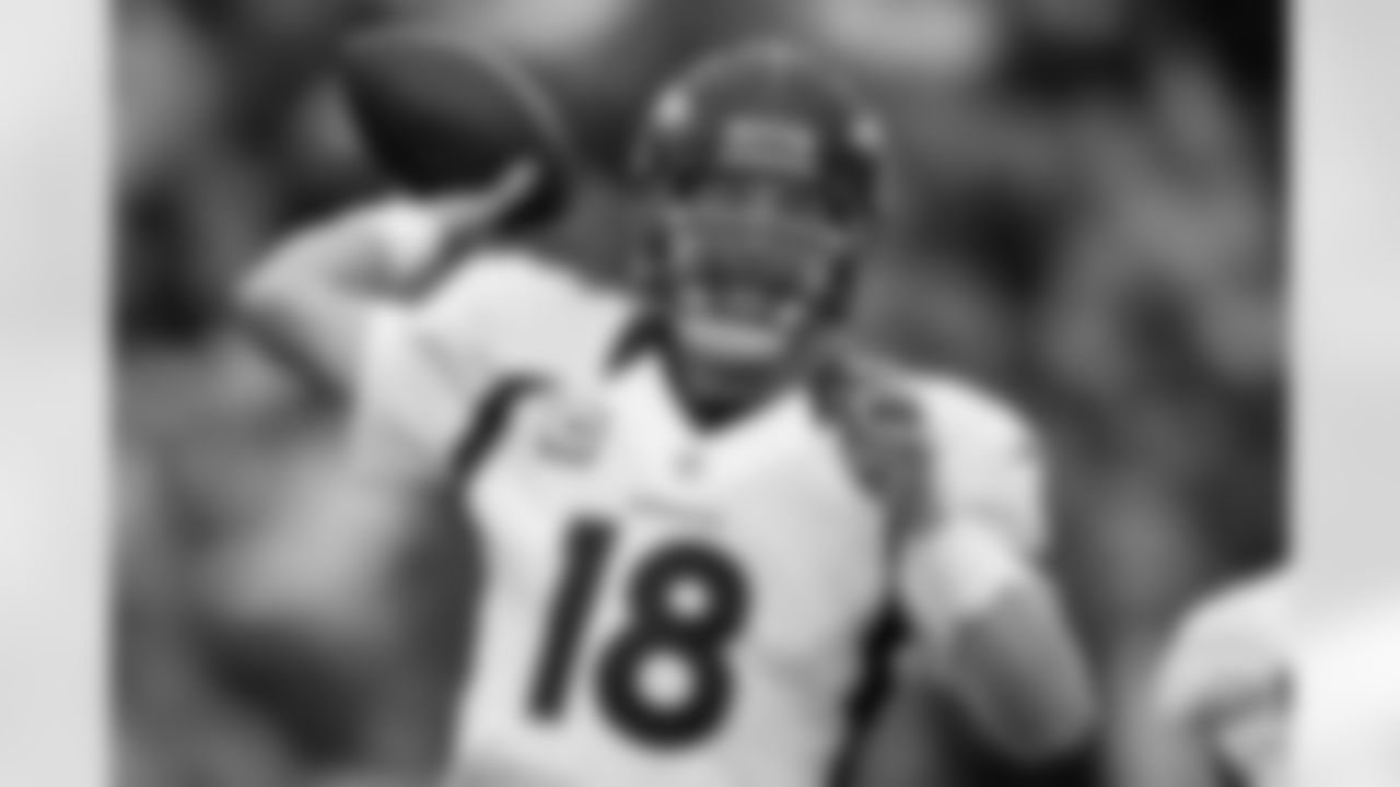 QB Peyton Manning throws a pass during the first half against the New England Patriots.