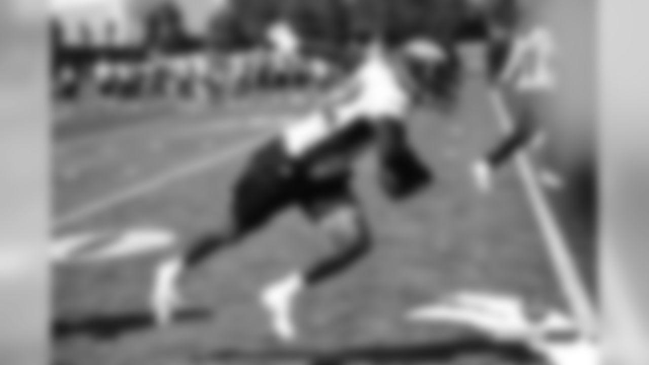 Kareem Jackson returns an interception at practice on the 18th day of training camp on August 15, 2019.