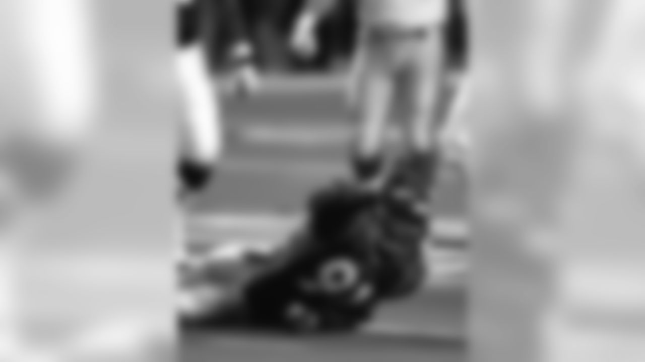 Alfred Williams lays on the turf after making a tackle against the Atlanta Falcons at GA Dome in Atlanta, GA on September 28, 1997.