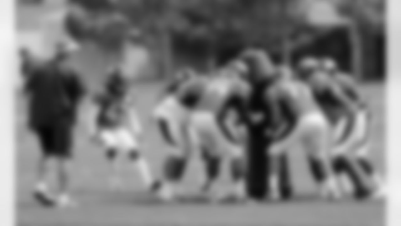 The defense swarms the ball during a drill at the beginning of practice.