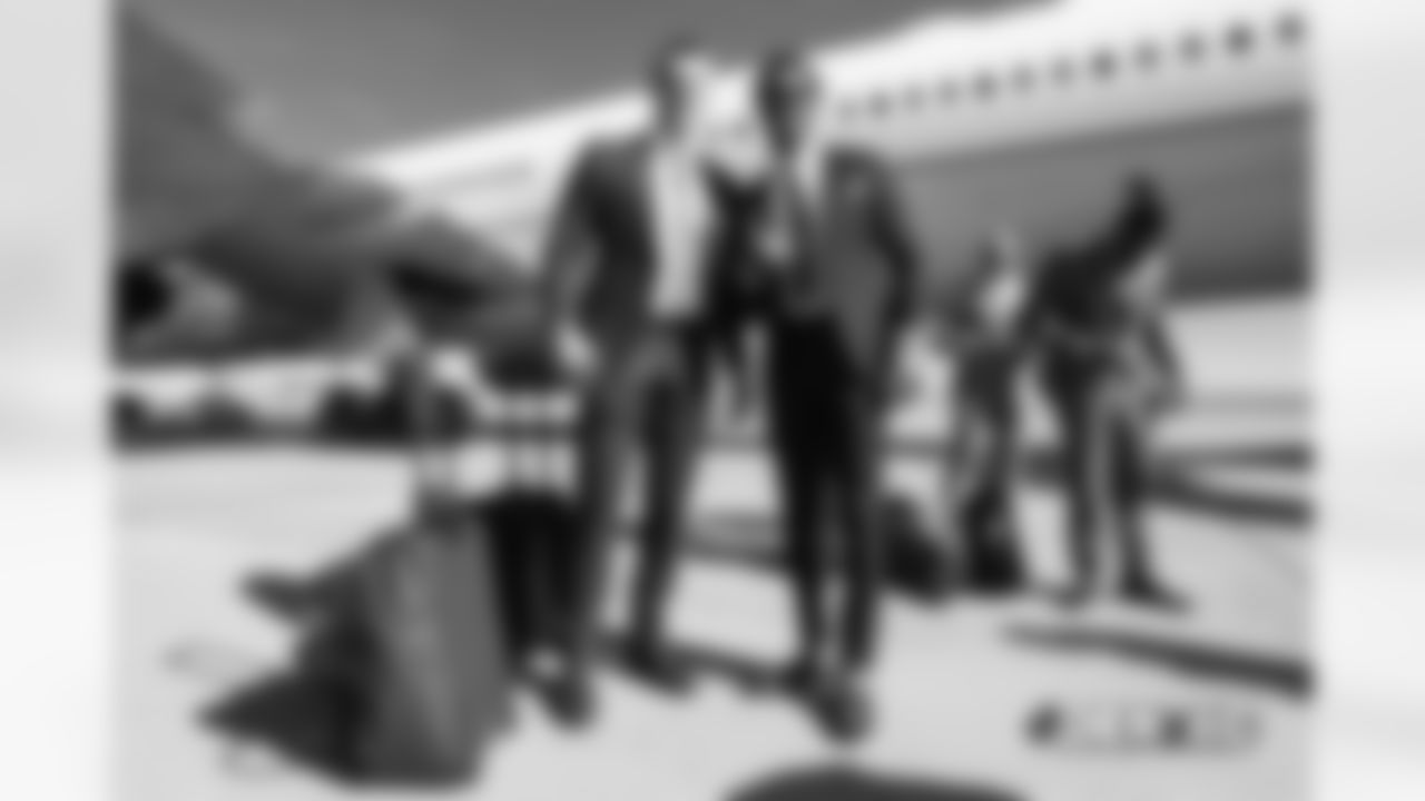 Jeff Heuerman and Demaryius ThomasÊwalks on the tarmac to the plane before the flight during the team's travel for their Week 8 game against the Kansas City Chiefs on October 27, 2018.