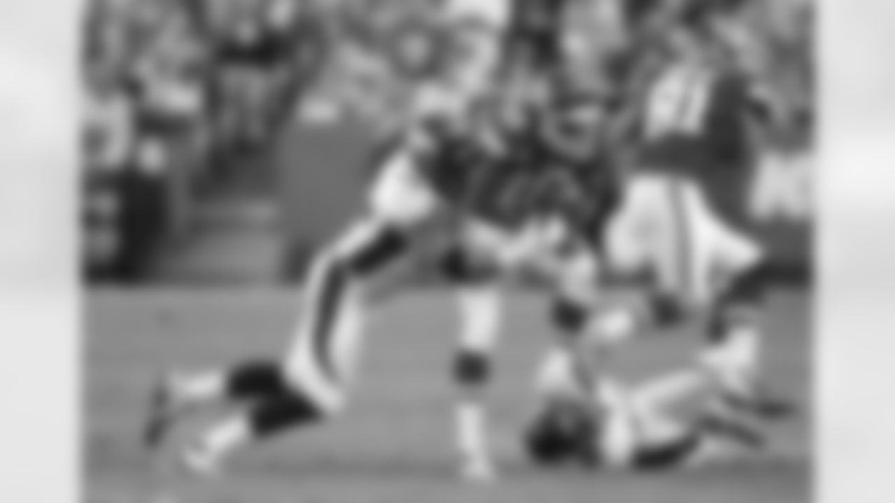 DE Derek Wolfe records a tackle during the second half.
