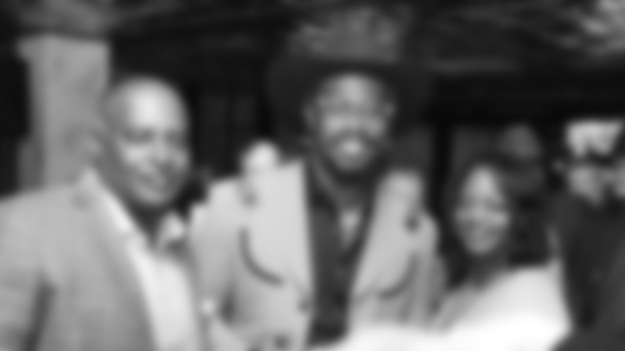 Von Miller poses with guests during Von's Vision at Mile High Station in Denver on November 5, 2018.