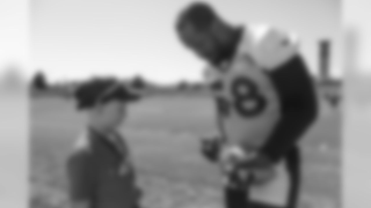 Chase, a Children's Hospital Colorado Junior Reporter, meets with Von Miller at UCHealth Training Center on September 26, 2018.