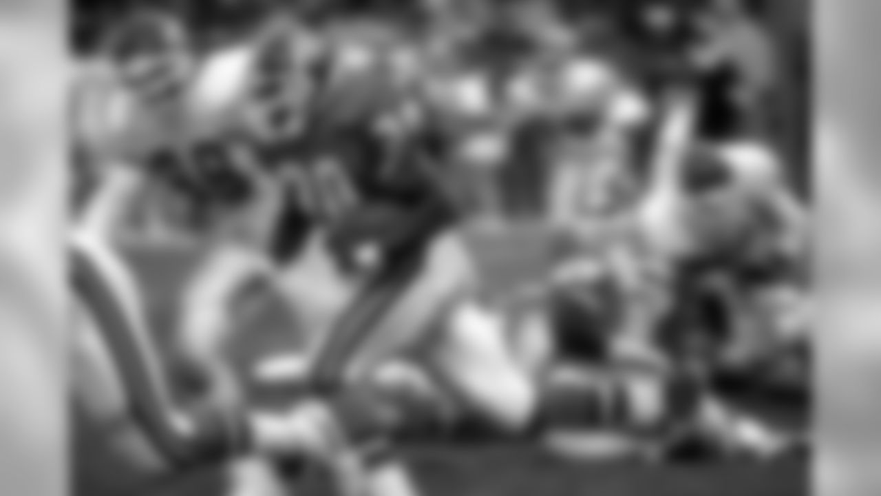 Running back Terrell Davis runs the ball upfield in a 1995 game against the Kansas City Chiefs.