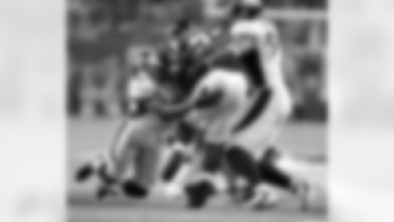 LB Joe Mays makes a tackle during second half action against the Atlanta Falcons.