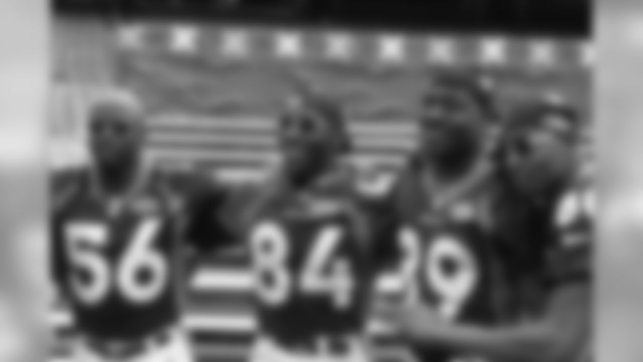 Denver Broncos linebacker Keith Burns (56), tight end Shannon Sharpe (84), tight end Dwayne Carswell (89) and wide receiver Rod Smith (80) pose for a photo during Super Bowl 32 Media Day on Tuesday, Jan. 20, 1998, in San Diego. (Kevin Terrell via AP)