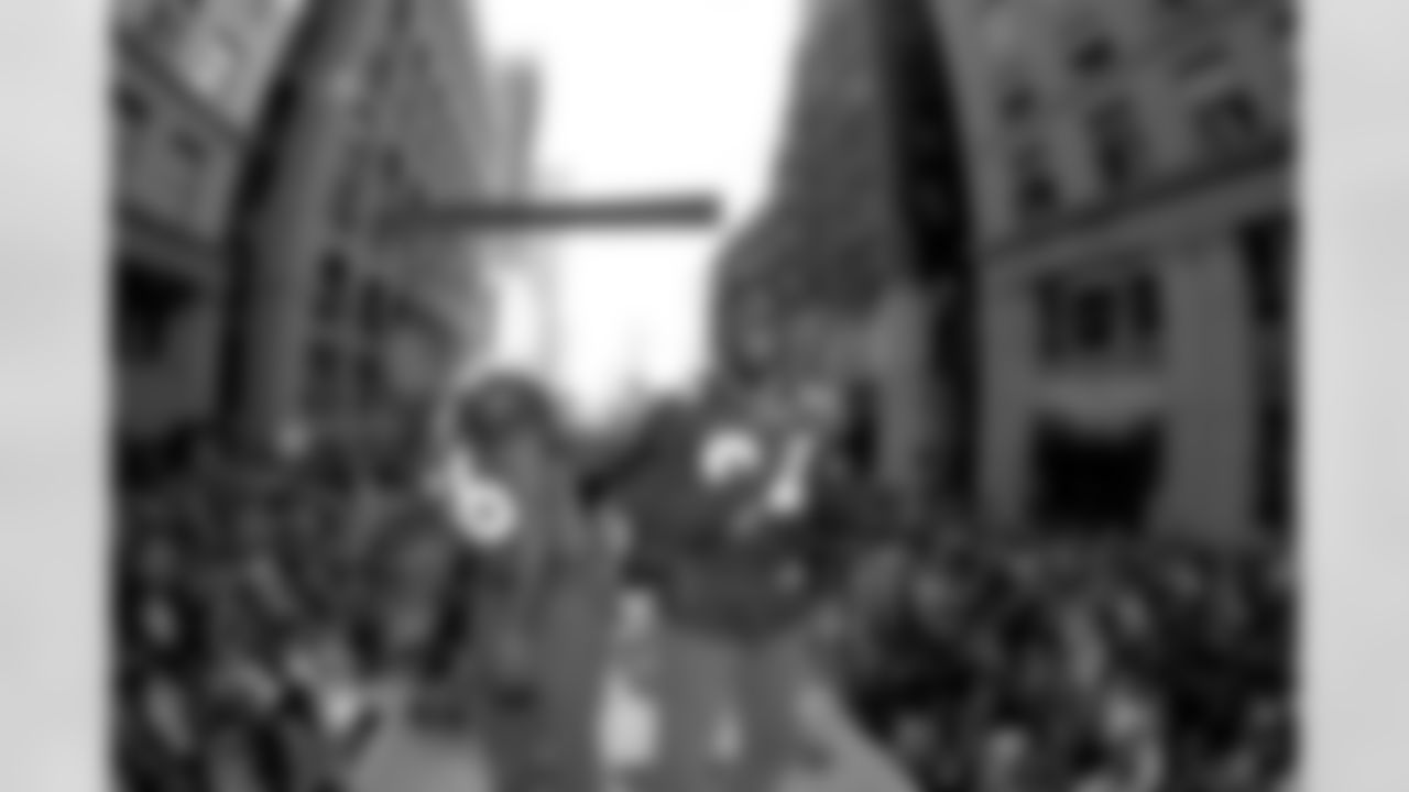Denver: An estimated 650,000 fans turned out along 17th Street, Broadway and Civic Center Park to cheer on the Broncos during their Championship Parade, the day after returning from the Super Bowl. Here, Keith Burns and Shannon Sharpe ride on the top of a fire truck.