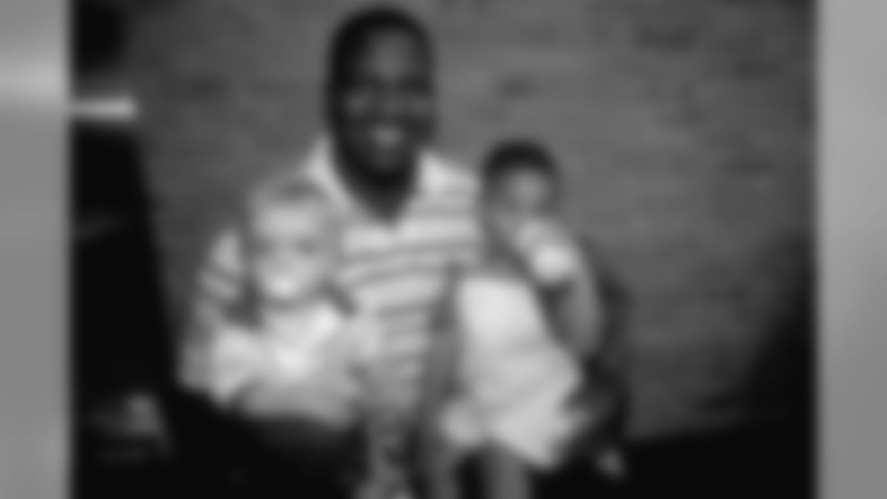 Alfred Williams with two kids at a Littlest Hearts event.
