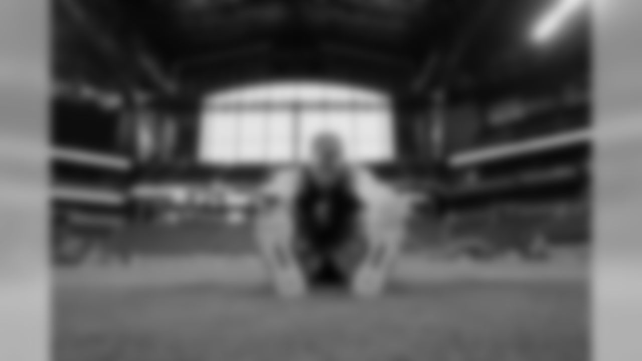 Utah offensive lineman Garett Bolles stretches at the NFL football scouting combine Friday, March 3, 2017, in Indianapolis. (AP Photo/David J. Phillip)