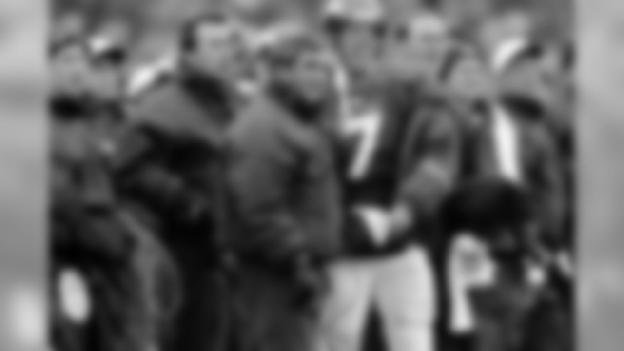 Denver Broncos head coach Mike Shanahan, Hall of Fame quarterback John Elway (7) and offensive coordinator Gary Kubiak watch from the during an NFL game against the Carolina Panthers on November 9,1997. The Broncos defeated the Panthers 34-0. (Peter Read Miller via AP)