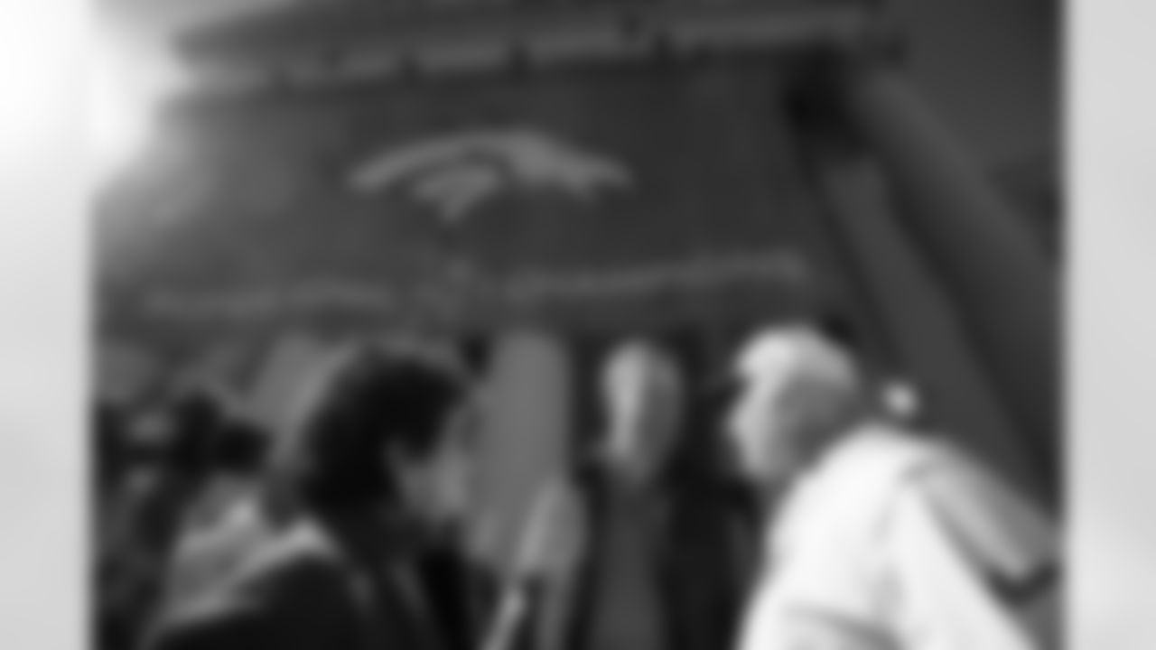 Peyton Manning talks with Wade Phillips during the Denver Broncos NFL Super Bowl 50 parade in Denver, Colo. February 9, 2016 (Photo by Gabriel Christus/ Denver Broncos)