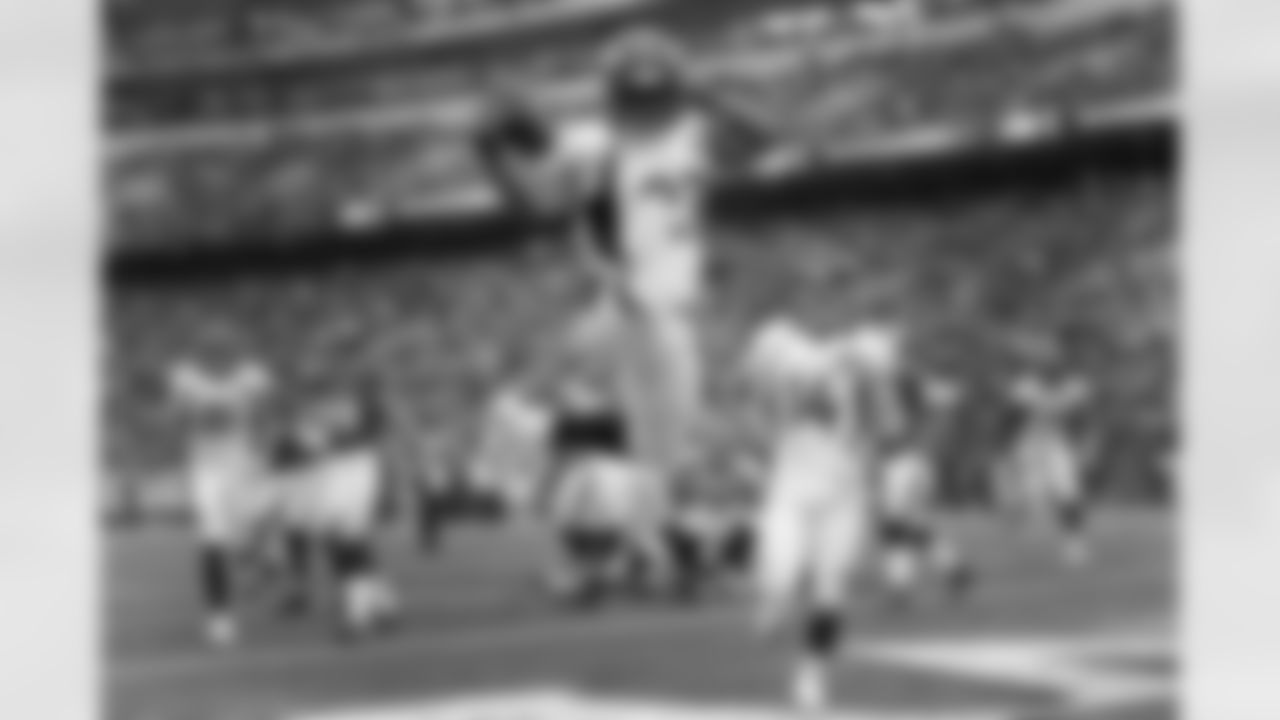 Moreno leaps in the air as he celebrates the touchdown.