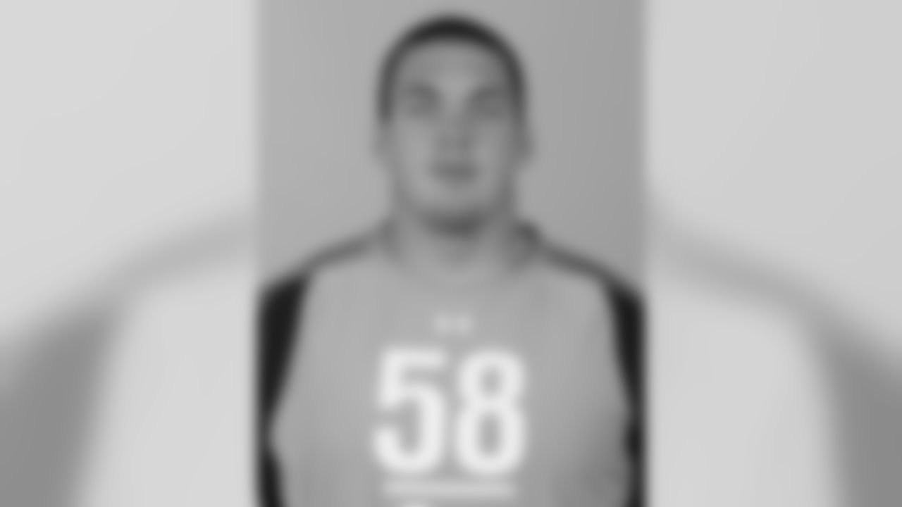 University of Cincinnatti defensive lineman Derek Wolfe poses for a headshot during the NFL Scouting Combine on Saturday, Feb. 25, 2012, in Indianapolis. (AP Photo/Ben Liebenberg)