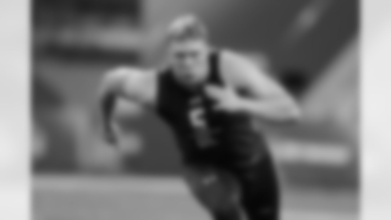 FILE - This March 3, 2017, file photo shows Utah offensive lineman Garett Bolles running a drill at the NFL football scouting combine in Indianapolis. Excellent athleticism has scouts excited about his potential. Wild card in a relatively weak offensive linemen class. Could be first off the board or Day 2 pick. (AP Photo/Michael Conroy, File)