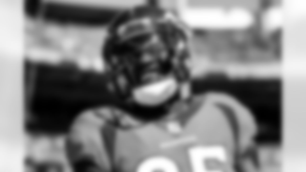 Melvin Gordon III smiles during pregame warmups before the game against the Baltimore Ravens on October 3, 2021 at Empower Field at Mile High in Denver, Colorado. (Photo by Ben Swanson)
