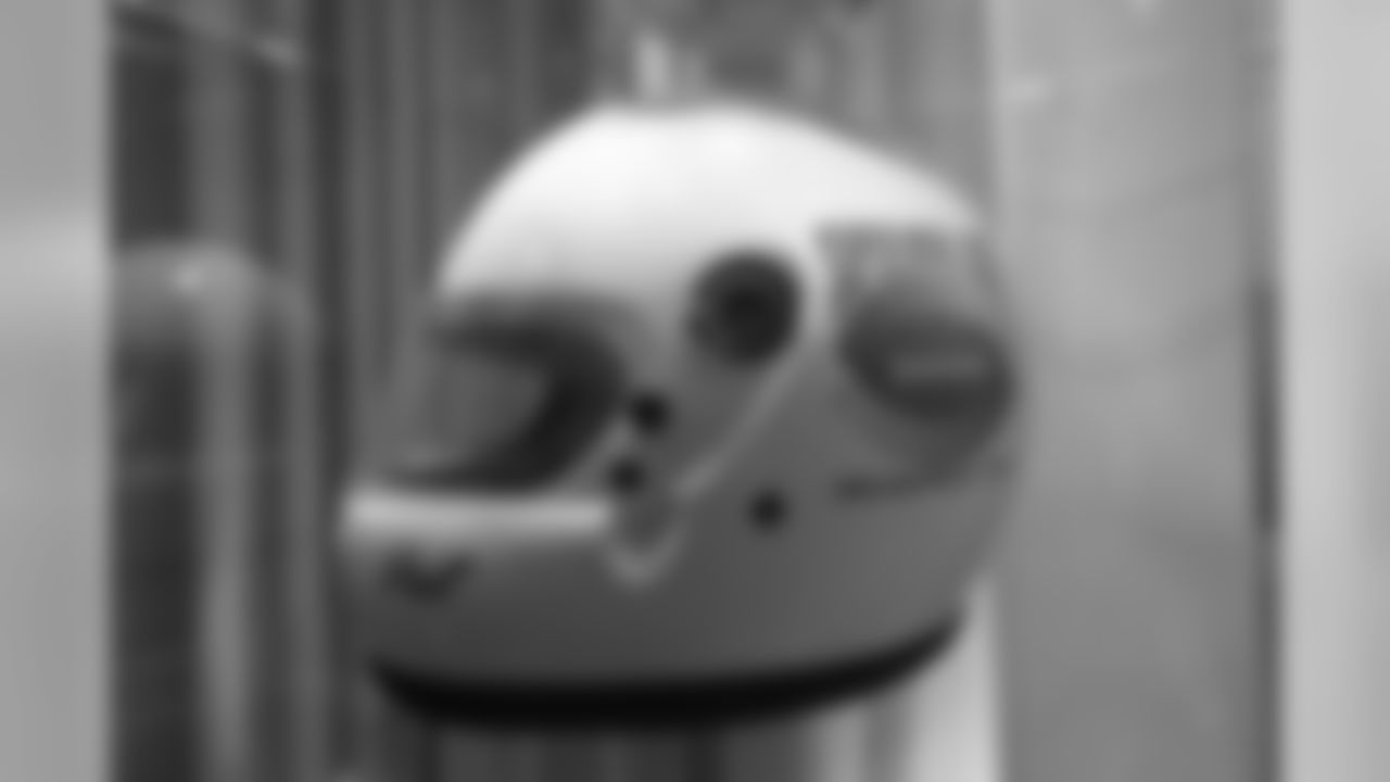 A race-car helmet made for Pat Bowlen (likely a gift during the site selection process for Super Bowl XXVI) is featured in a display at the open-house tribute to Pat Bowlen at Broncos Stadium at Mile High on June 18, 2019.