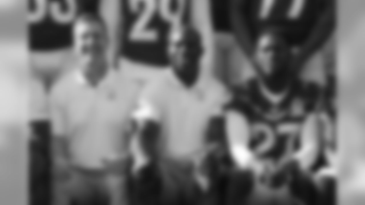 Ring of Fame and Pro Football Hall of Fame running back Terrell Davis, seated next to Ravens head coach John Harbaugh and Buffalo Bills cornerback Tre'Davious White (27), during the AFC's team photo session for the 2020 Pro Bowl outside the team hotel in Orlando, Florida, on January 23, 2020. (Photo by Ben Swanson/DenverBroncos.com)
