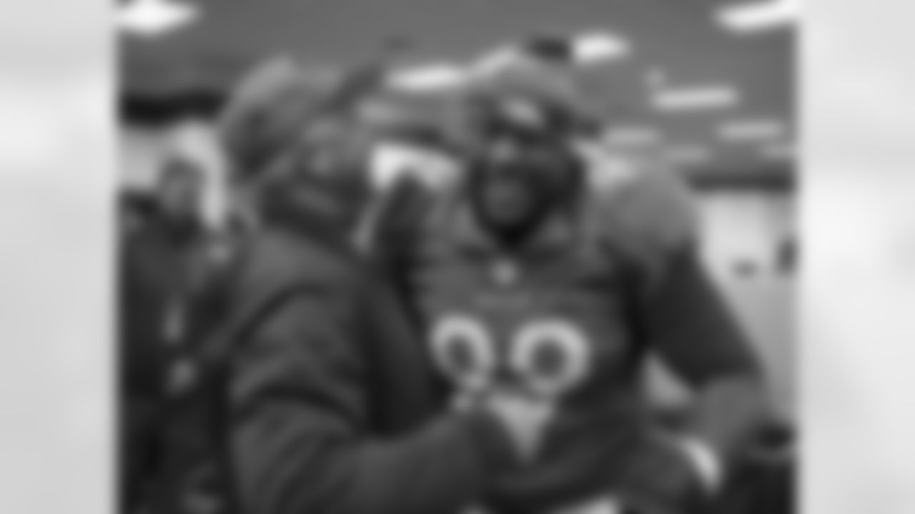 Fox and defensive tackle Kevin Vickerson celebrate the win, which wraps up a 13-3 regular season, securing the No. 1 seed in the AFC Playoffs and home-field advantage throughout the postseason.