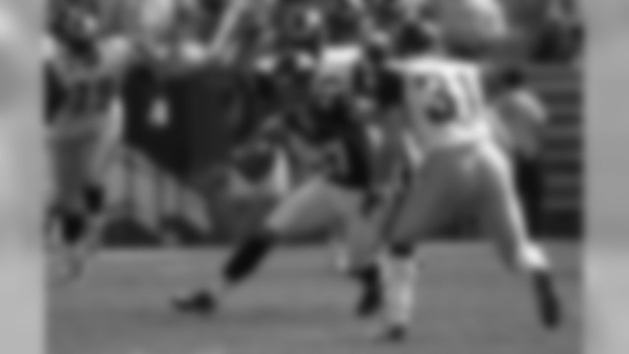 Ed McCaffrey makes a reception against the St. Louis Rams at Invesco Field at Mile High in Denver, CO on September 8, 2002.